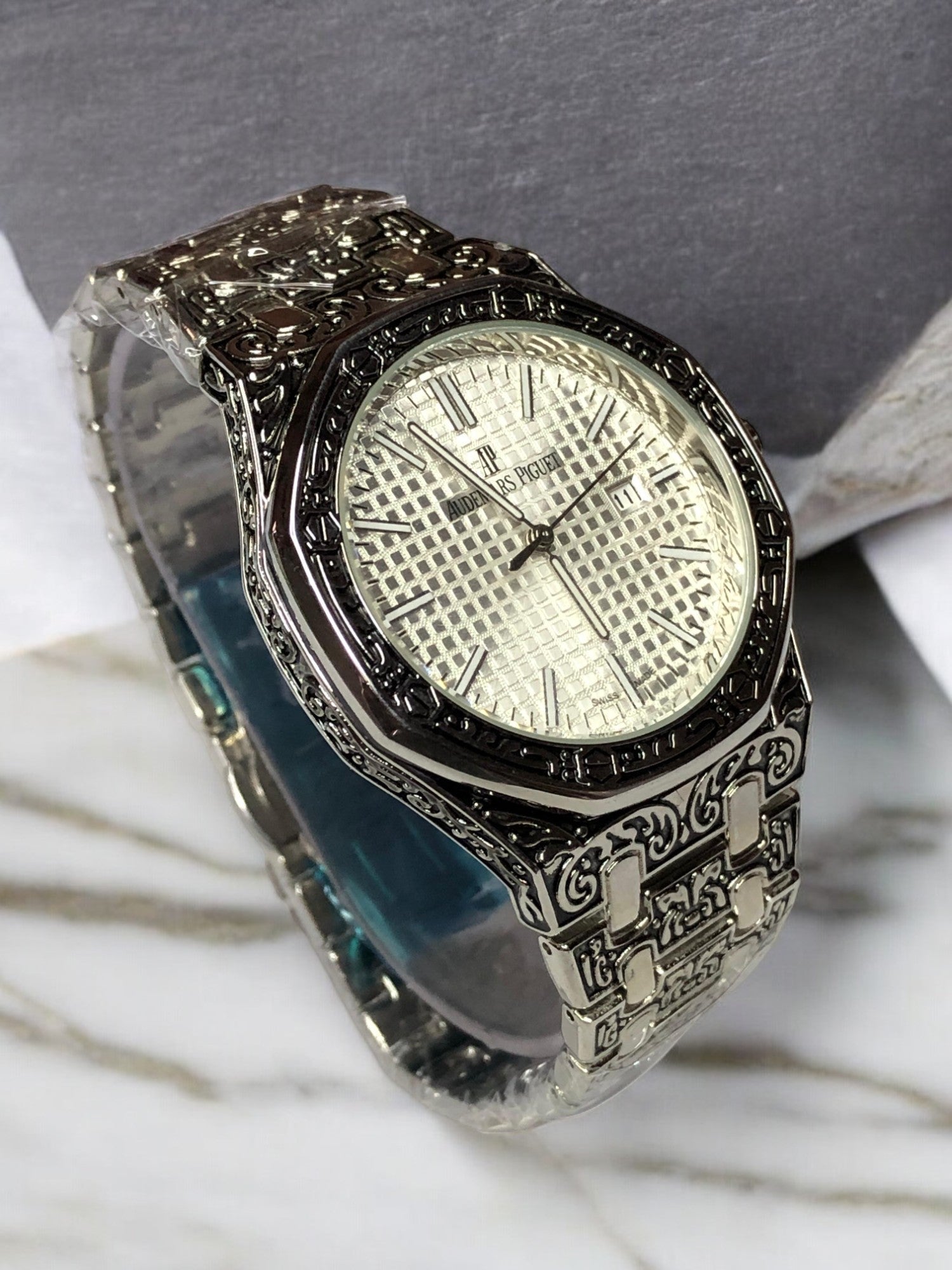 Audemars Piguet silver watch with exquisite craftsmanship, sleek design, and a sophisticated look. Ideal for luxury watch enthusiasts and those seeking a refined, high-end timepiece.