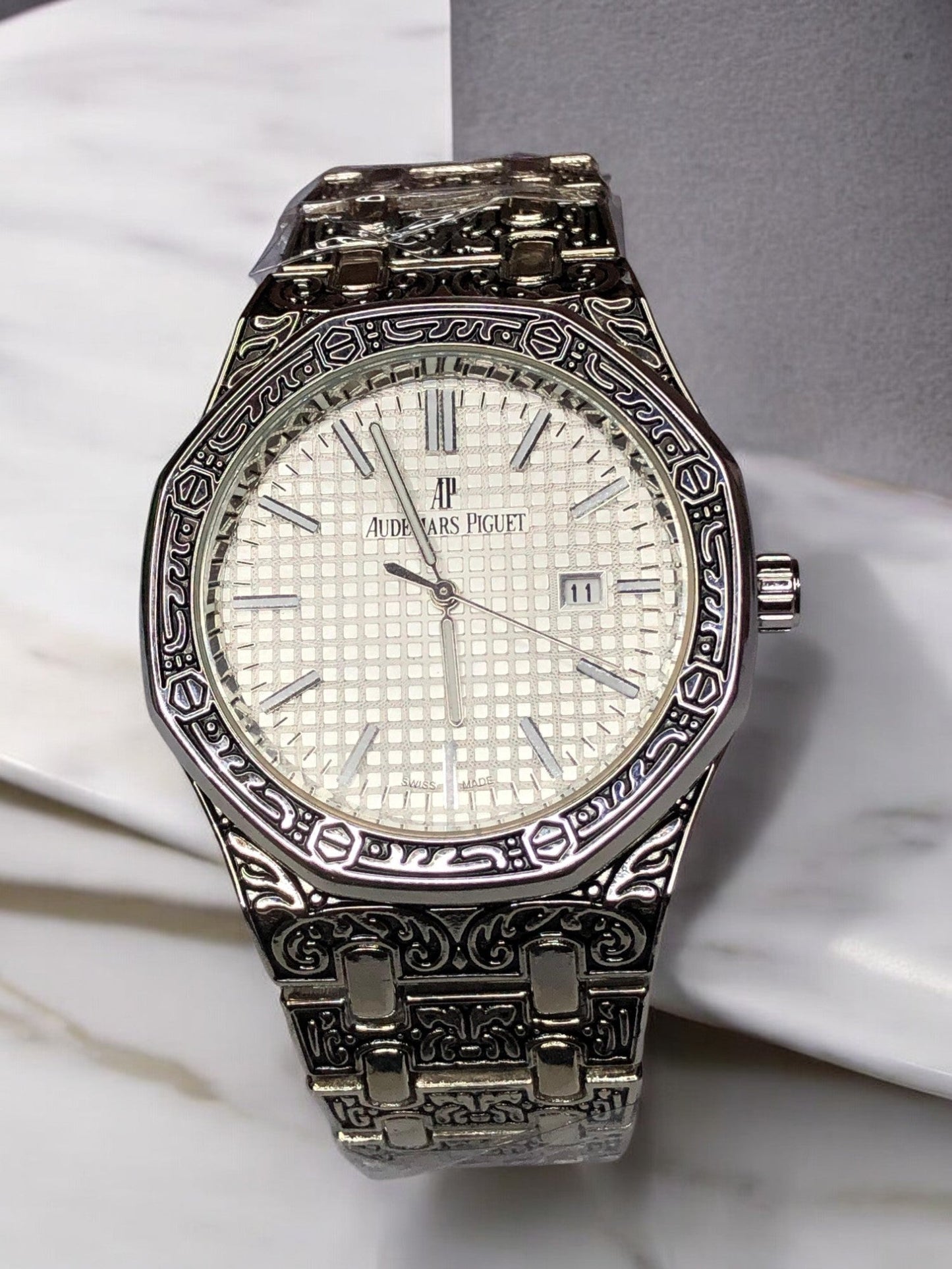 Audemars Piguet silver watch with exquisite craftsmanship, sleek design, and a sophisticated look. Ideal for luxury watch enthusiasts and those seeking a refined, high-end timepiece.